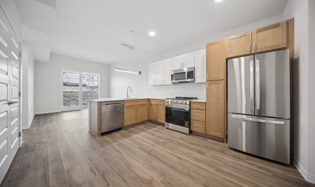 open kitchen with stainless steel appliances